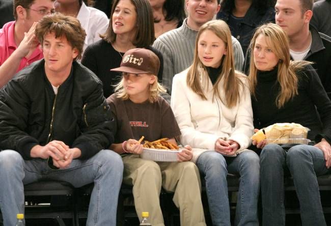 Robin Wright and Sean Penn with their two kids at a basketball game