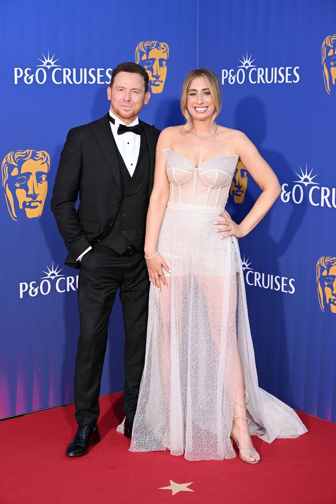 Stacey Solomon in a sheer corset jumpsuit with Joe Swash