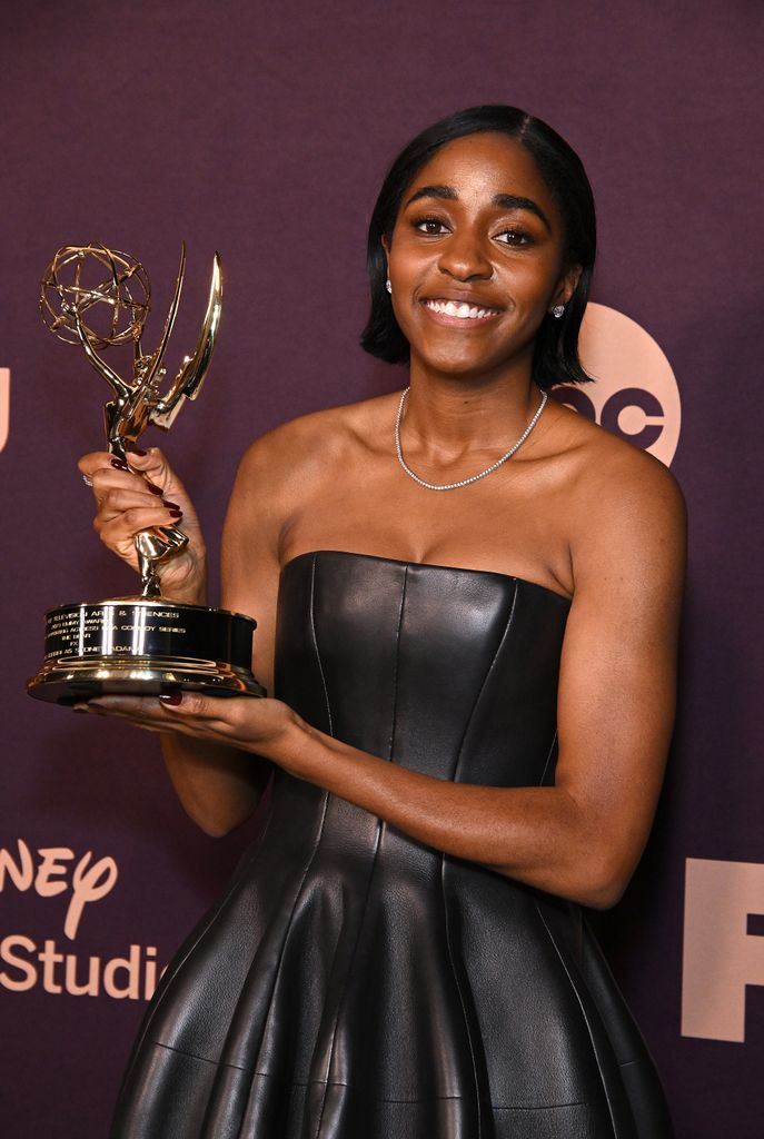 LOS ANGELES, CALIFORNIA - JANUARY 15: Actress Ayo Edebiri poses with her Emmy Award for Outstanding Supporting Actress at the Walt Disney Company Emmy Awards party at Otium on January 15, 2024 in Los Angeles, California. (Photo by Michael Tullberg/FilmMagic)