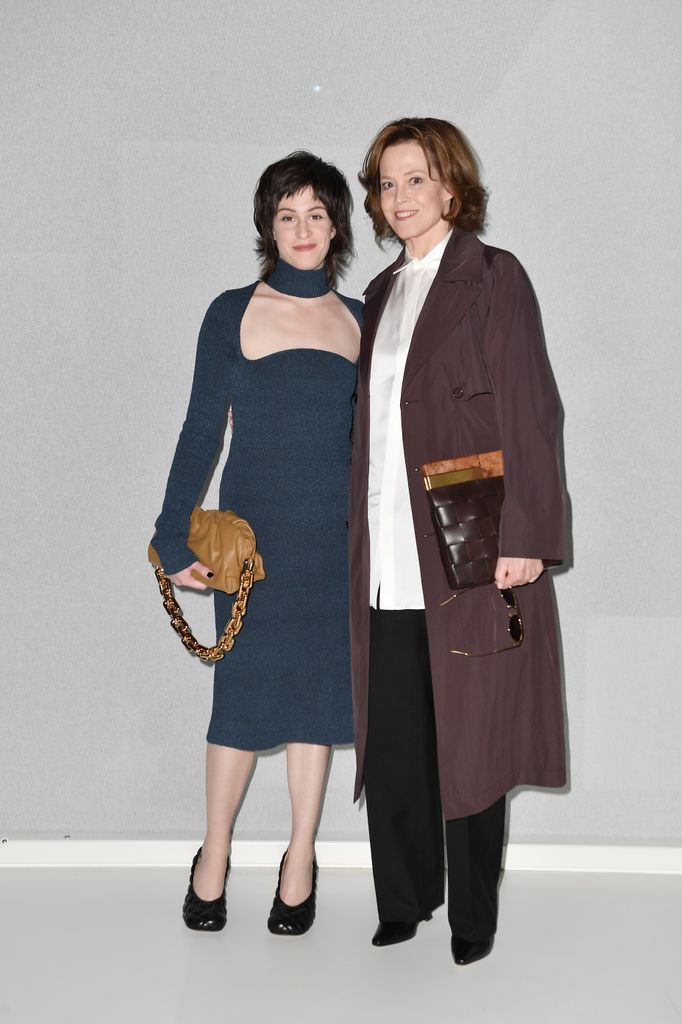 Shar Simpson in blue dress and Sigourney Weaver in brown coat at the Bottega Veneta fashion show in 2020