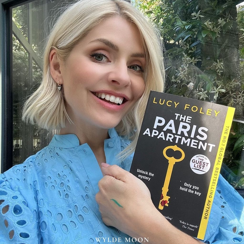 Holly Willoughby holding a book