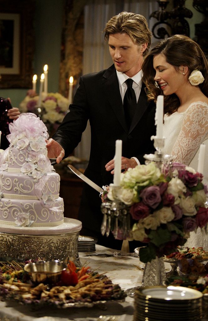 J.T. Hellstrom (Thad Luckinbill, left) and Victoria Newman (Amelia Heinle, right) celebrate their wedding, on The Young And The Restless