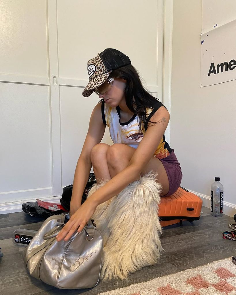 girl with silver bag and yeti boots