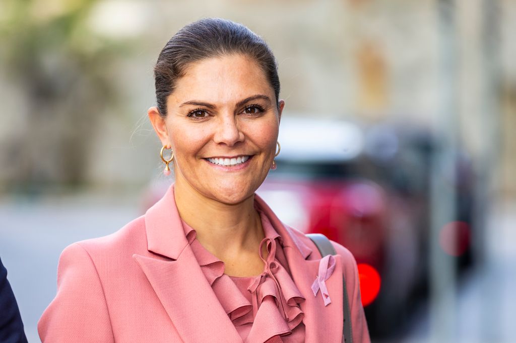 Crown Princess Victoria of Sweden in pink ruffle blouse