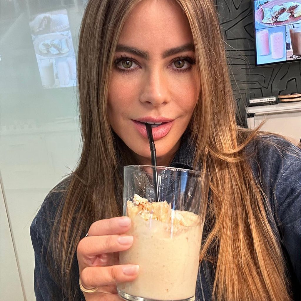 Sofia Vergara drinking through a straw