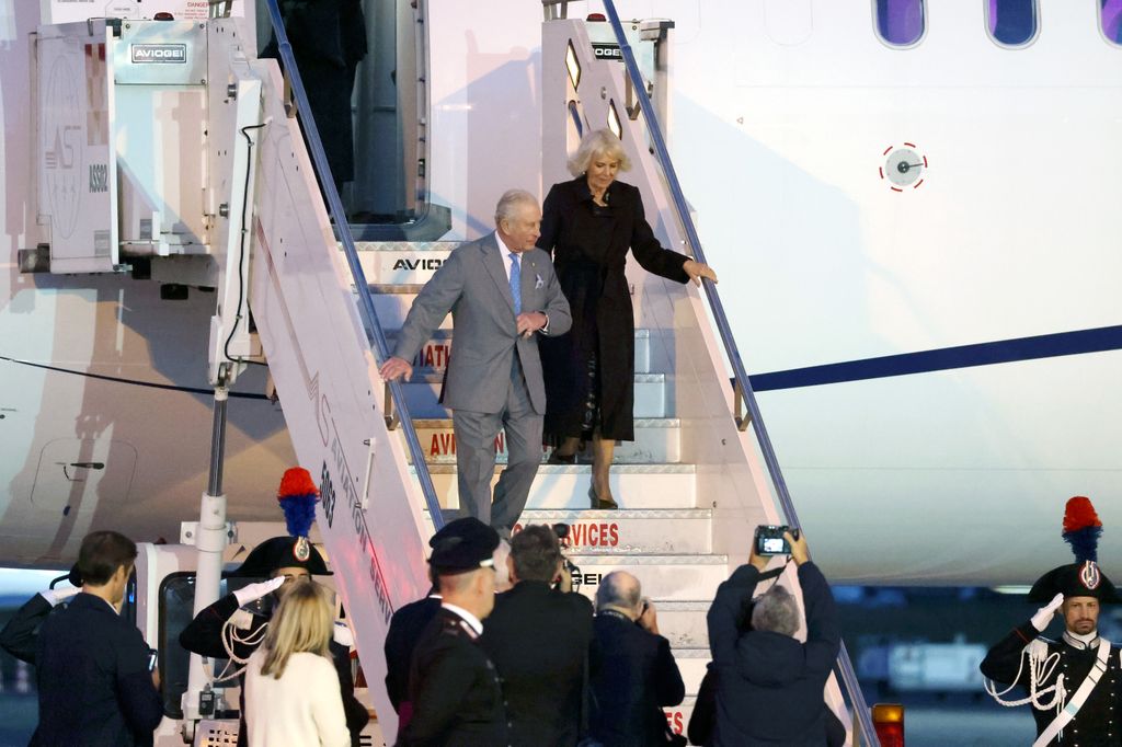 King Charles and Queen Camilla disembarking a plane