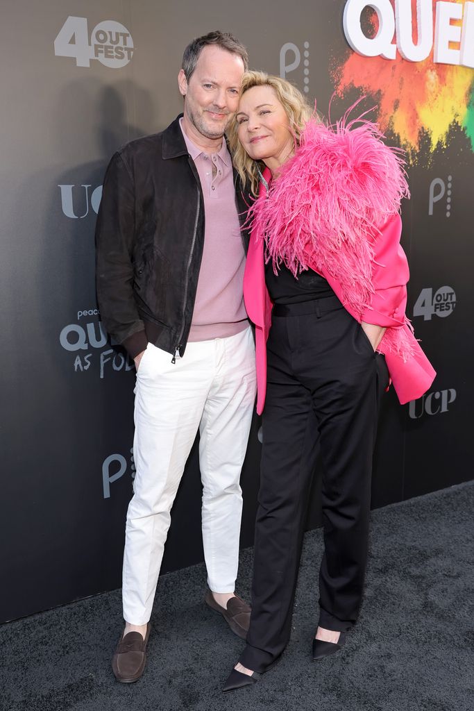 The couple smiling while attending the premiere of Peacock's Queer As Folk in 2022