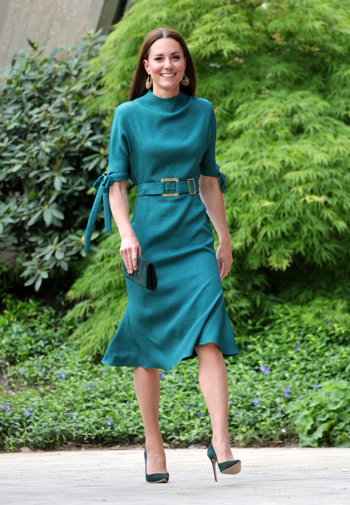 Catherine, Duchess of Cambridge walking in teal midi dress