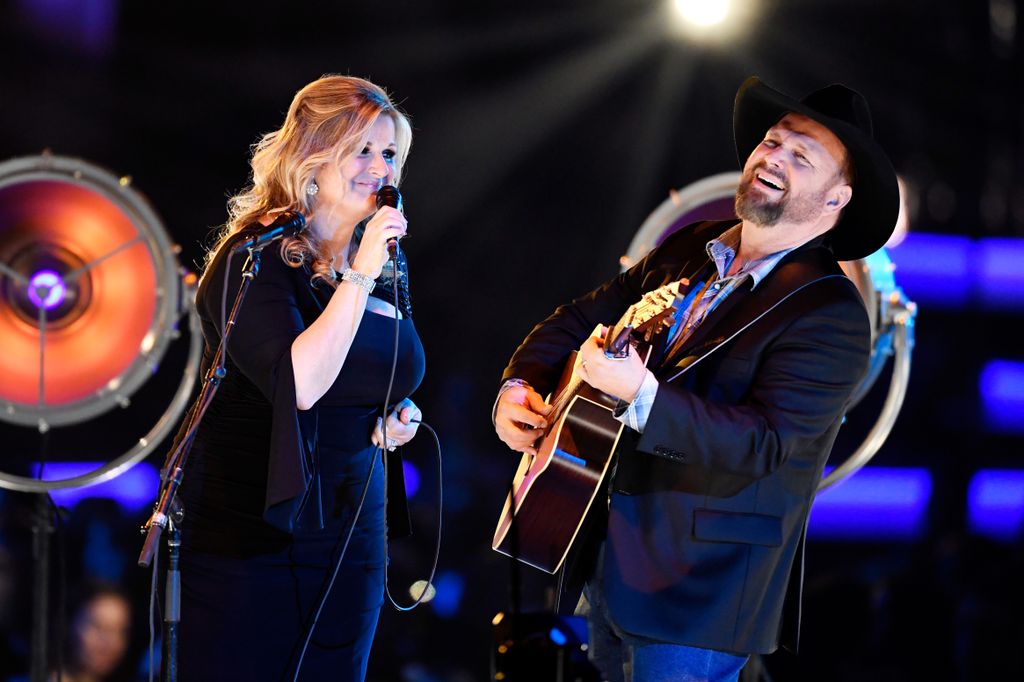 Trisha Yearwood and Garth Brooks perform onstage during MusiCares Person of the Year honoring Dolly Parton at Los Angeles Convention Center on February 8, 2019 in Los Angeles, California