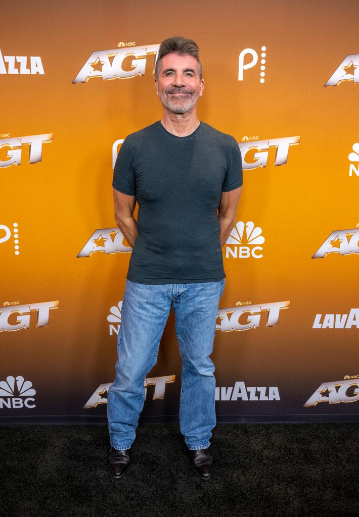 Simon Cowell wearing jeans and gray T-shirt at the America's Got Talent"Season 20 semifinals red carpet at Hotel Dena