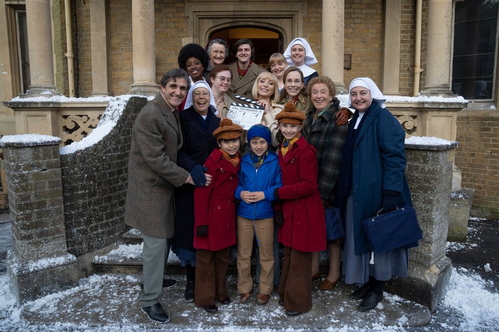 Group of people standing outside snowy building