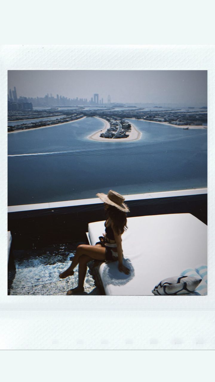 Michelle Keegan posing by the pool in Dubai