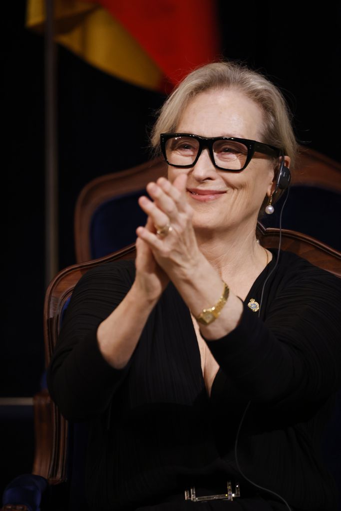 Meryl Streep clapping and smiling