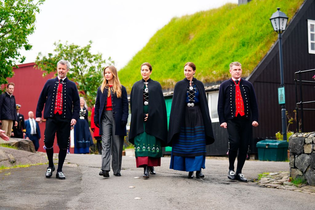 The royals with the governor of the Faroe Islands, Aksel V. Johannsen (R) and his wife Katrin Apol (2R) during the visit to the government buildings in the old town of Tinganes in Torshavn 