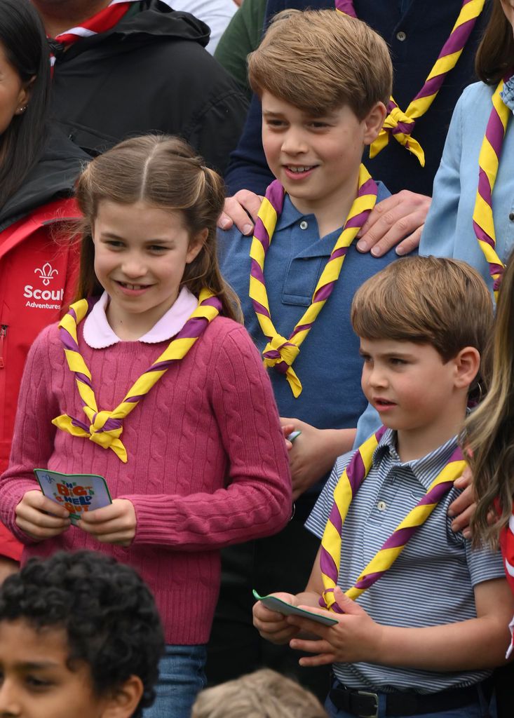 Prince George, Princess Charlotte and Prince Louis with a group of volunteers