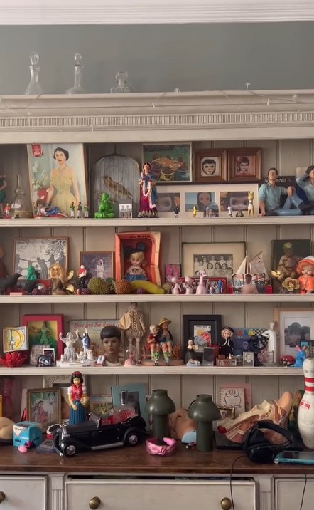 eclectic dresser has been covered in figurines