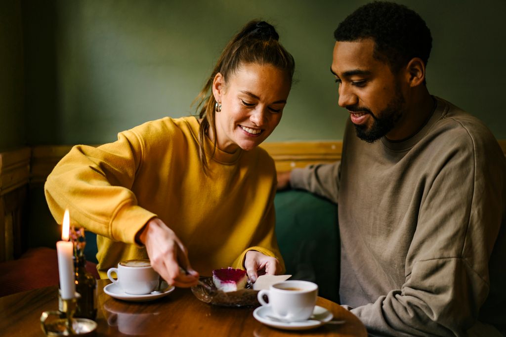 Couple sharing dessert and coffee on a day date