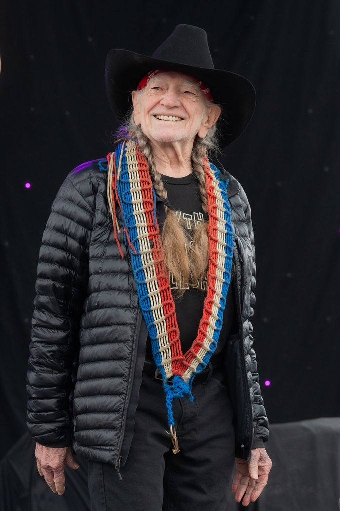 willie nelson on stage smiling
