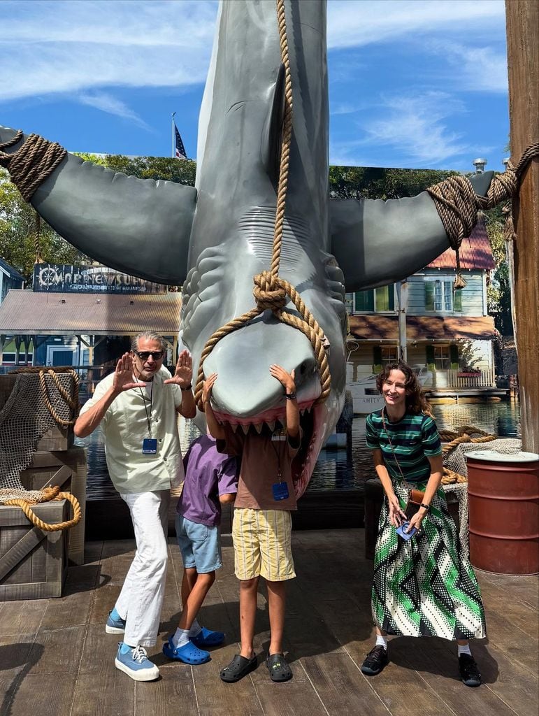 photo of jeff goldblum standing beside jaws at universal studios