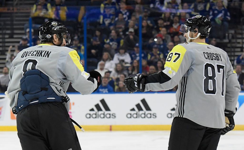 Alex Ovechkin and Sidney Crosby fist bumping