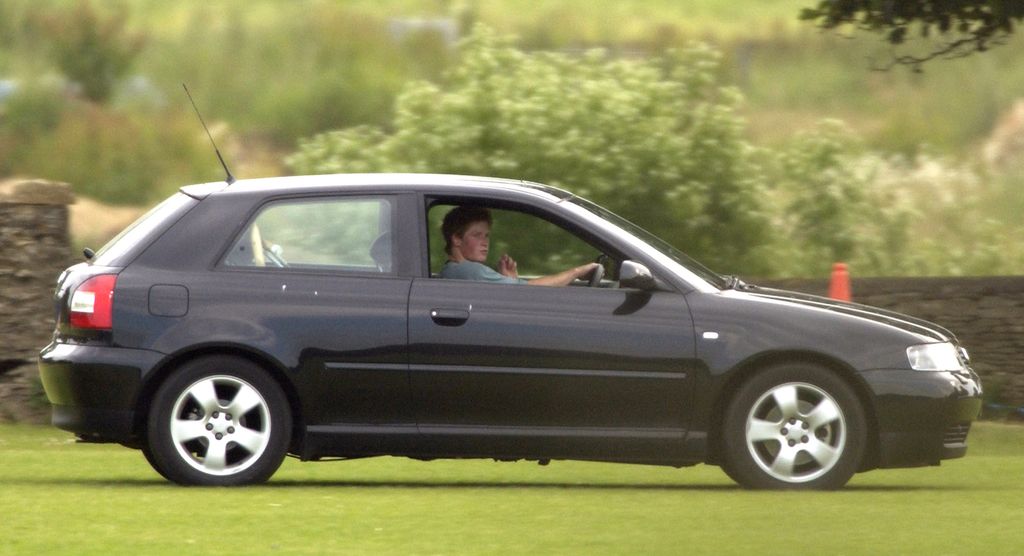 Prince Harry arriving at Beaufort Polo Club in his new Audi A3 hatchback