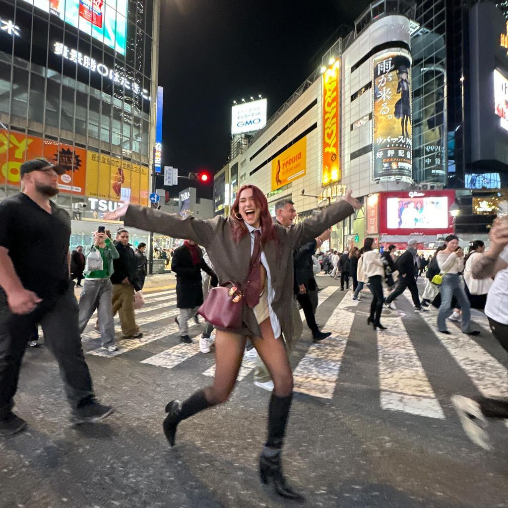 Dua Lipa stuns in short shorts and sheer stockings for Tokyo outing