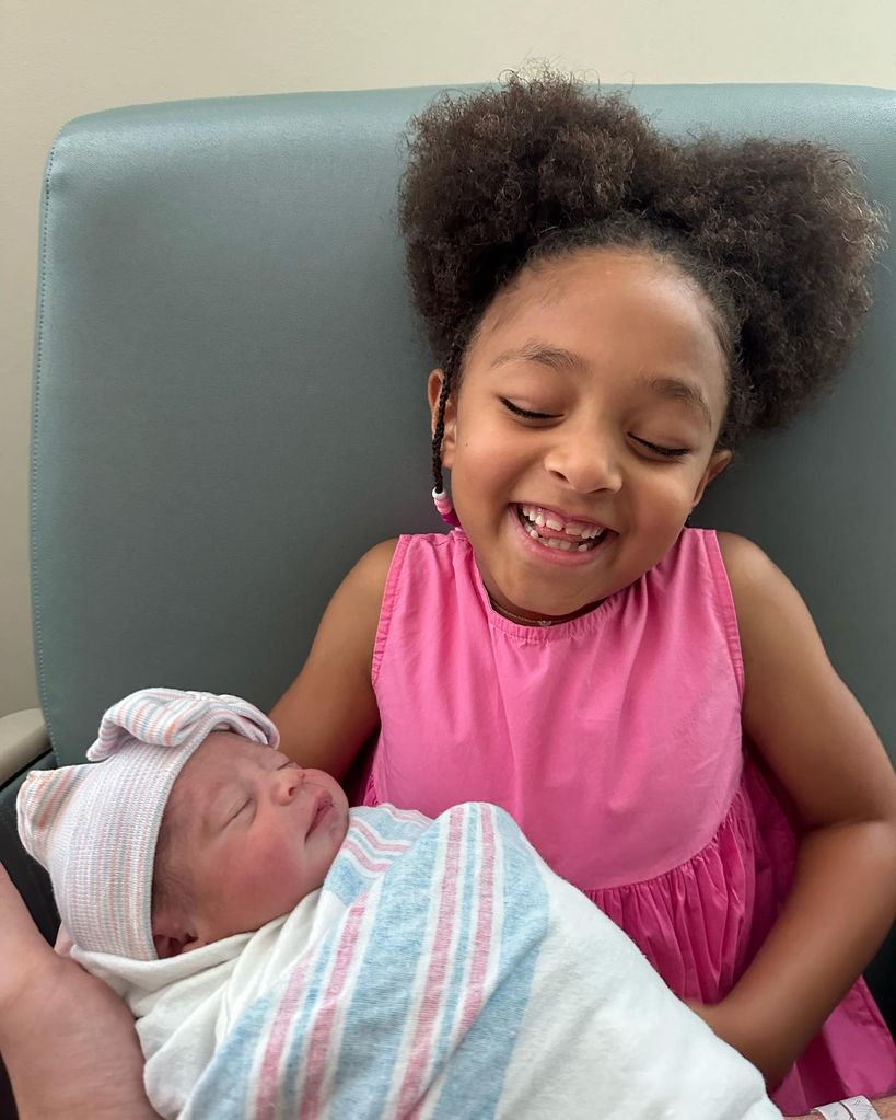 Olympia holding baby Adira