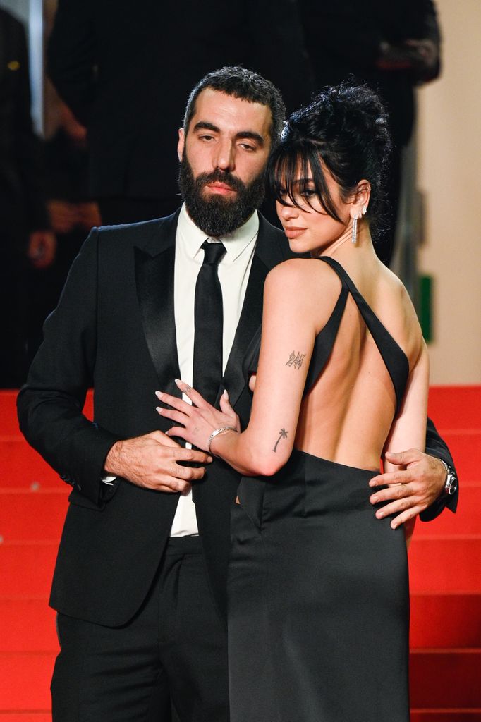 Dua Lipa and Romain Gavras attend the "Omar La Fraise (The King of Algiers)" red carpet during the 76th annual Cannes film festival at Palais des Festivals on May 19, 2023 in Cannes, France.