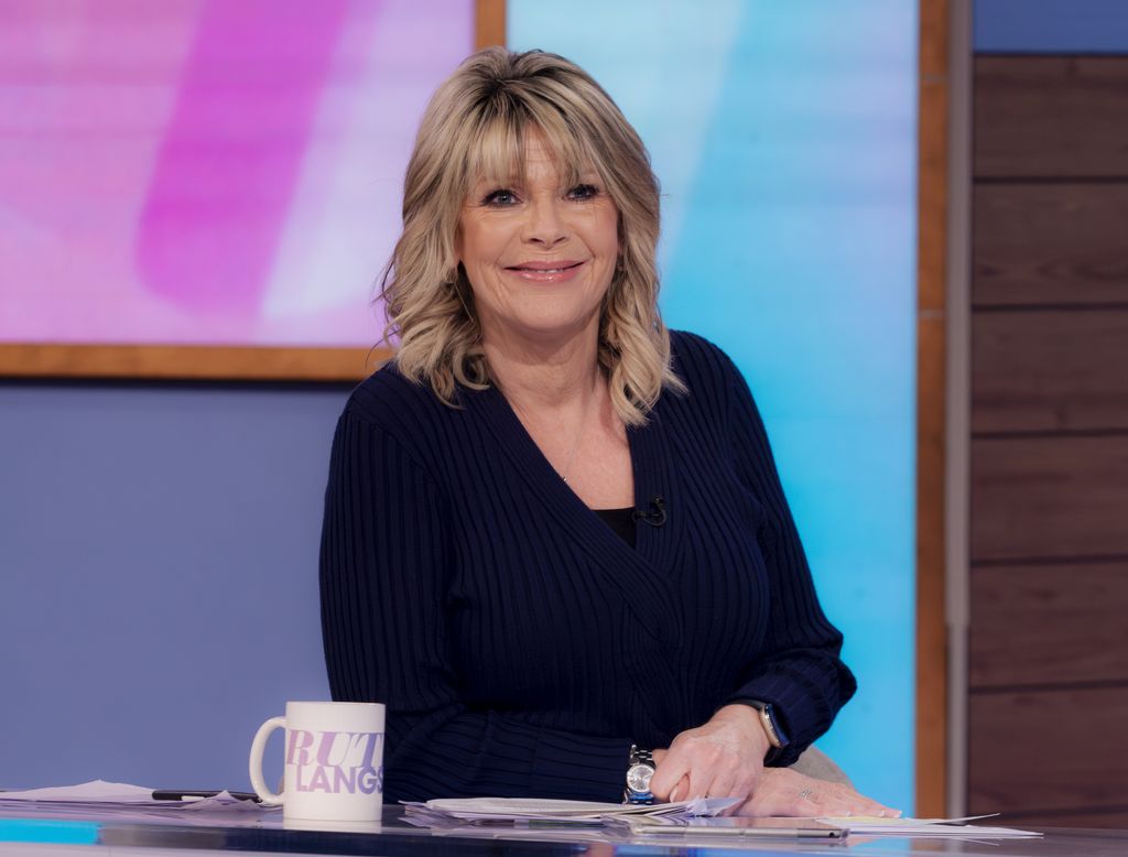 Blonde woman smiling in TV studio