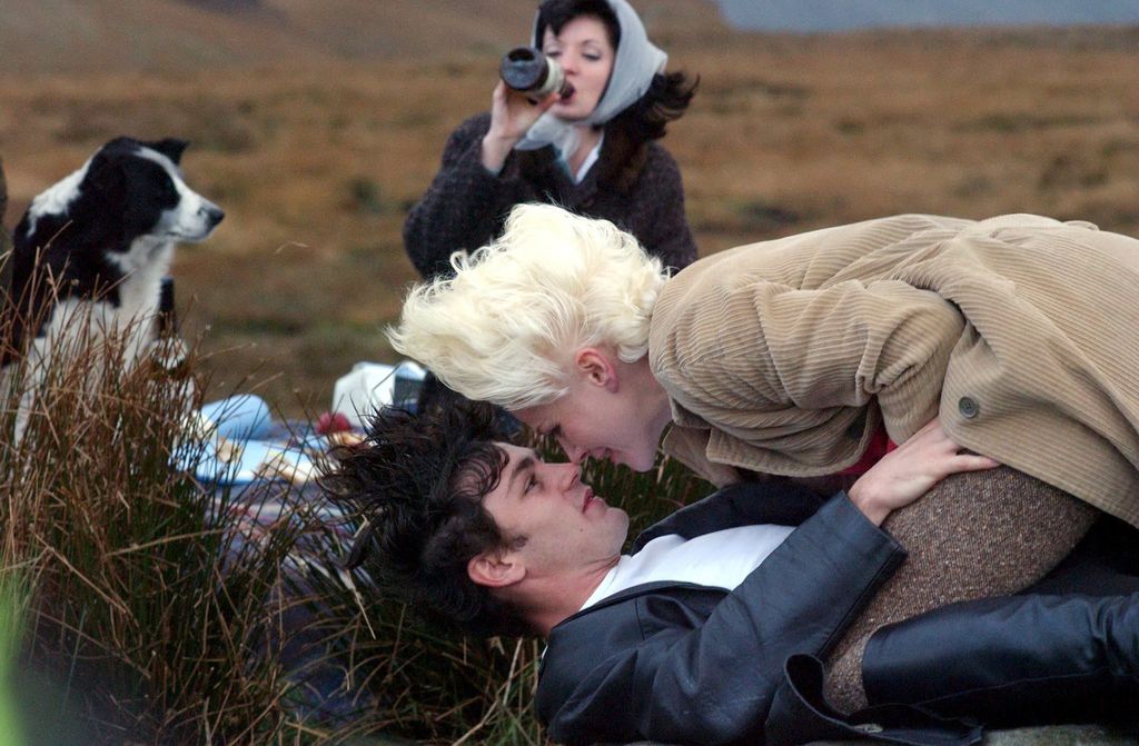 Woman lying on top of a man in moors