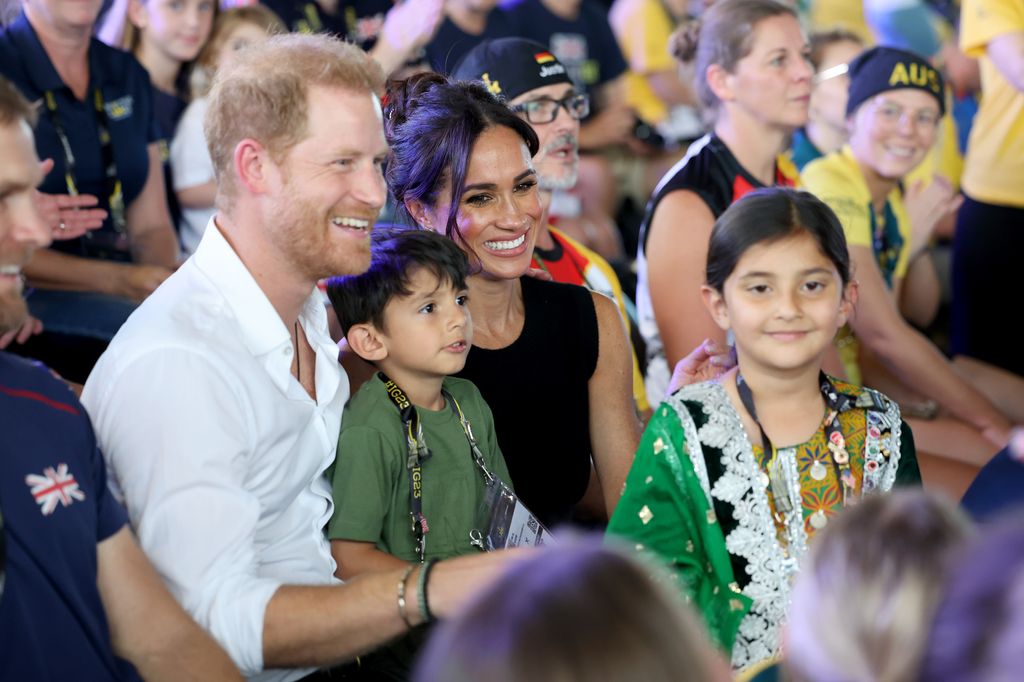 Prince Harry and Meghan Markle smiling