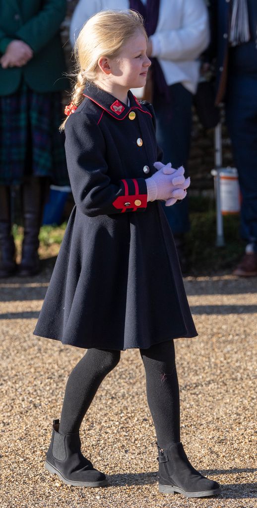 Lena Tindall side on in navy coat