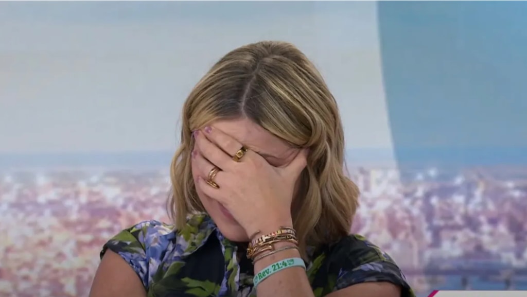 Jenna with her hand on her face
