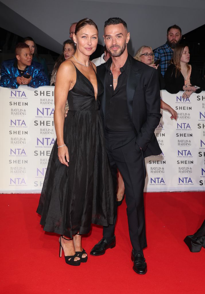 Emma Willis and Matt Willis on red carpet in black