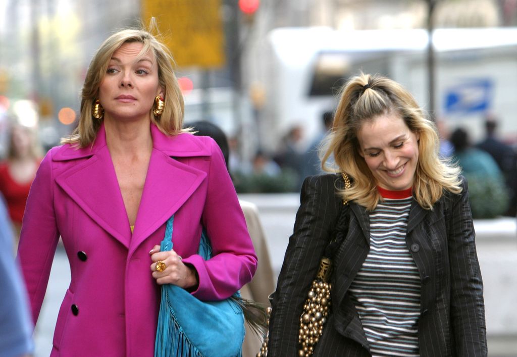 Kim Cattrall and Sarah Jessica Parker during Kim Cattrall and Sarah Jessica Parker On Location For "Sex And The City" at Saks Fifth Ave in New York, New York, United States. (Photo by James Devaney/WireImage)