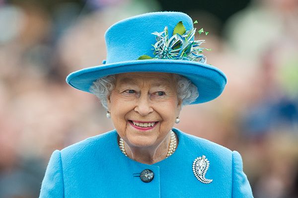 The Queen is dressed in a blue suit