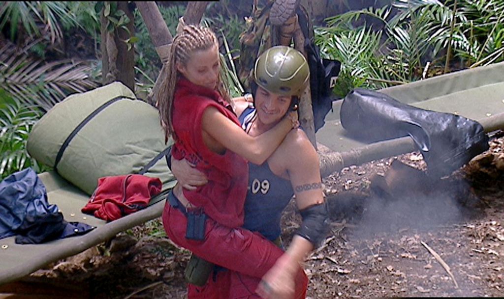 Peter Andre holding Katie Price aloft in the I'm a Celebrity jungle