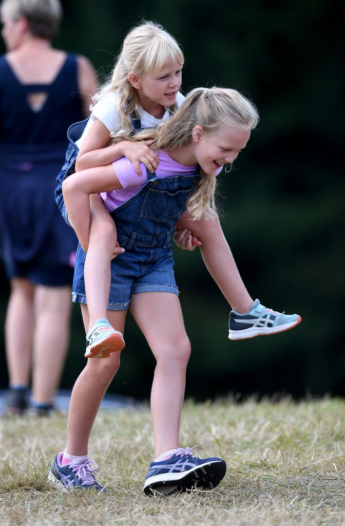 Isla gets a piggyback from her big sister at the 2019 Festival of British Eventing at Gatcombe Park. Looks like they had a fun time!