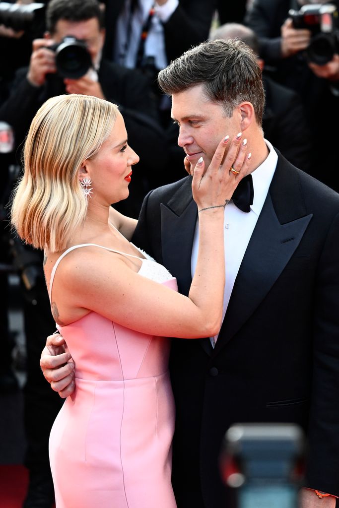 Scarlett Johansson and Colin Jost on the "Asteroid City" red carpet during the 76th Annual Cannes Film Festival at the Palais des Festivals on May 23, 2023 in Cannes, France.