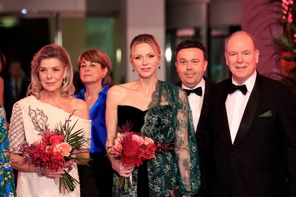 Princess Caroline of Hanover, Princess Charlene of Monaco and Prince's Albert II of Monaco pose during the 69th edition of the "Bal de la Rose" (Rose Ball) event at the Monte-Carlo Sporting Club in Monaco,