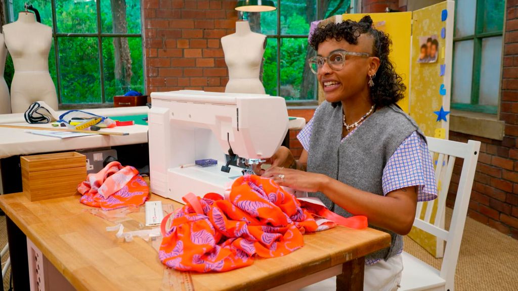 young woman using sewing machine