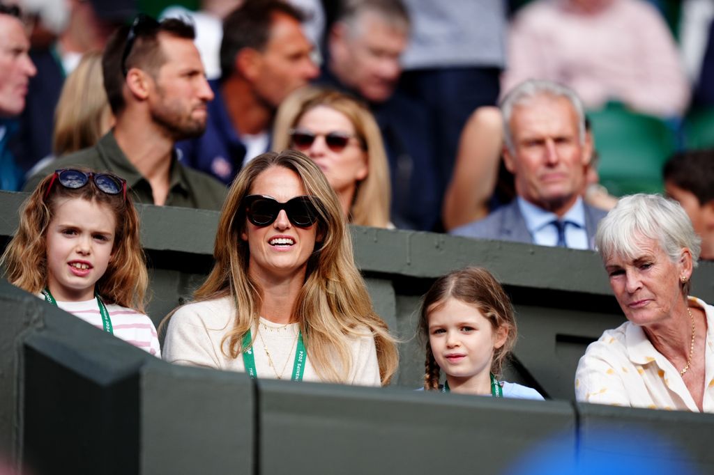 family watching tennis match 