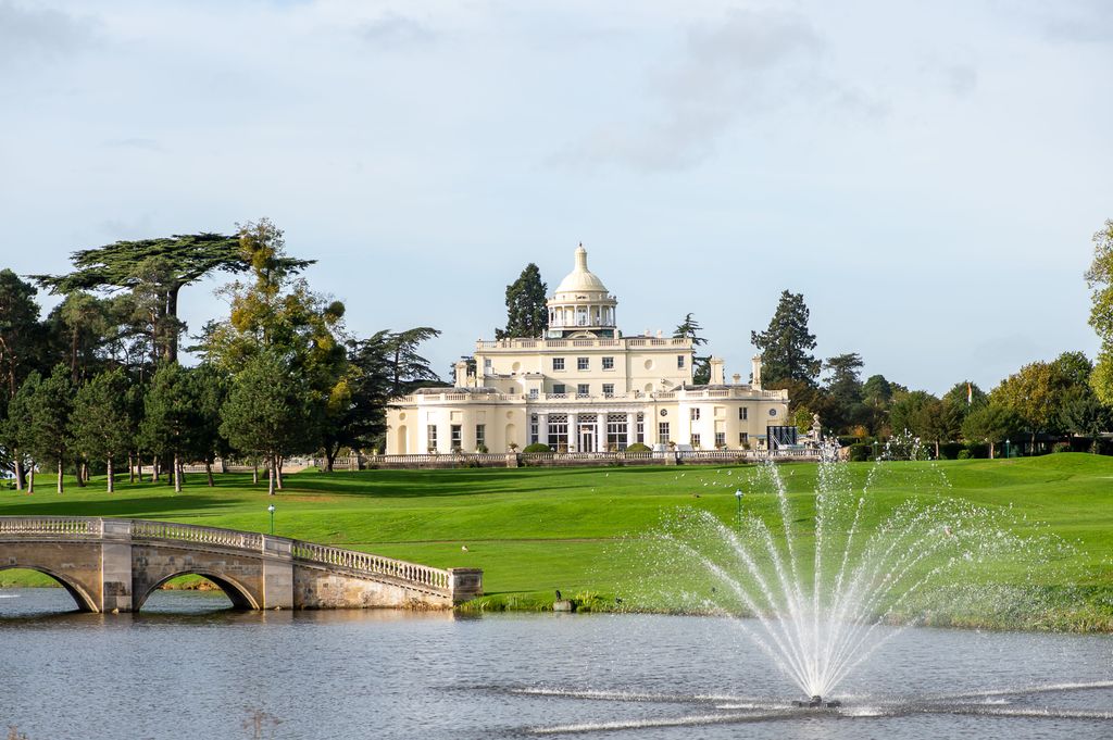 Stoke Park mansion house with a fountain and a bridge