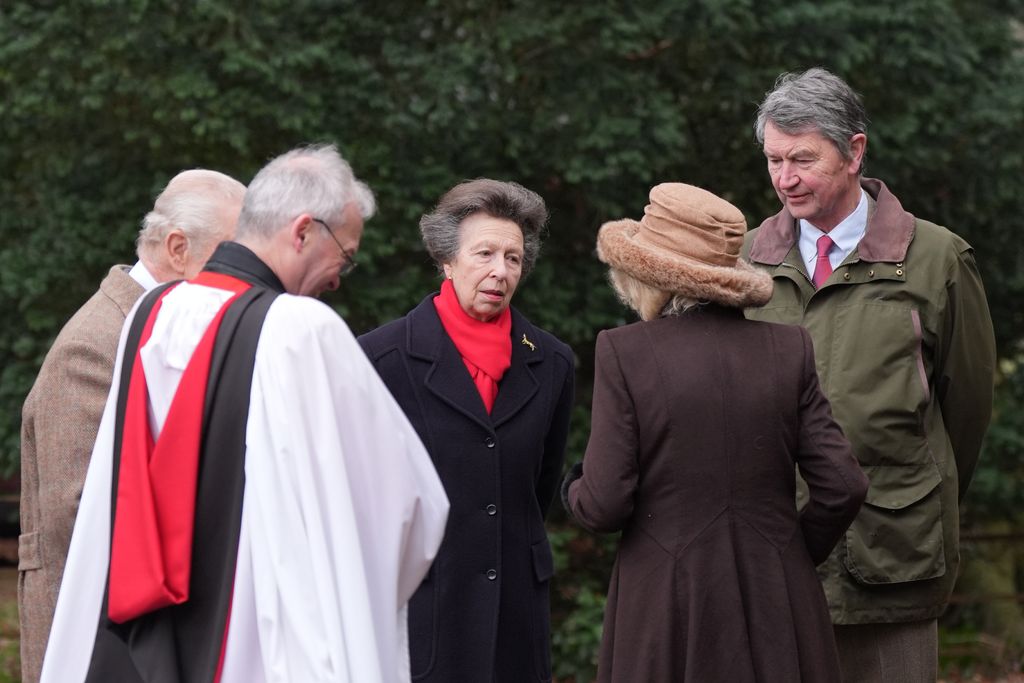 Princess Anne and Queen Camilla talking outside in coats