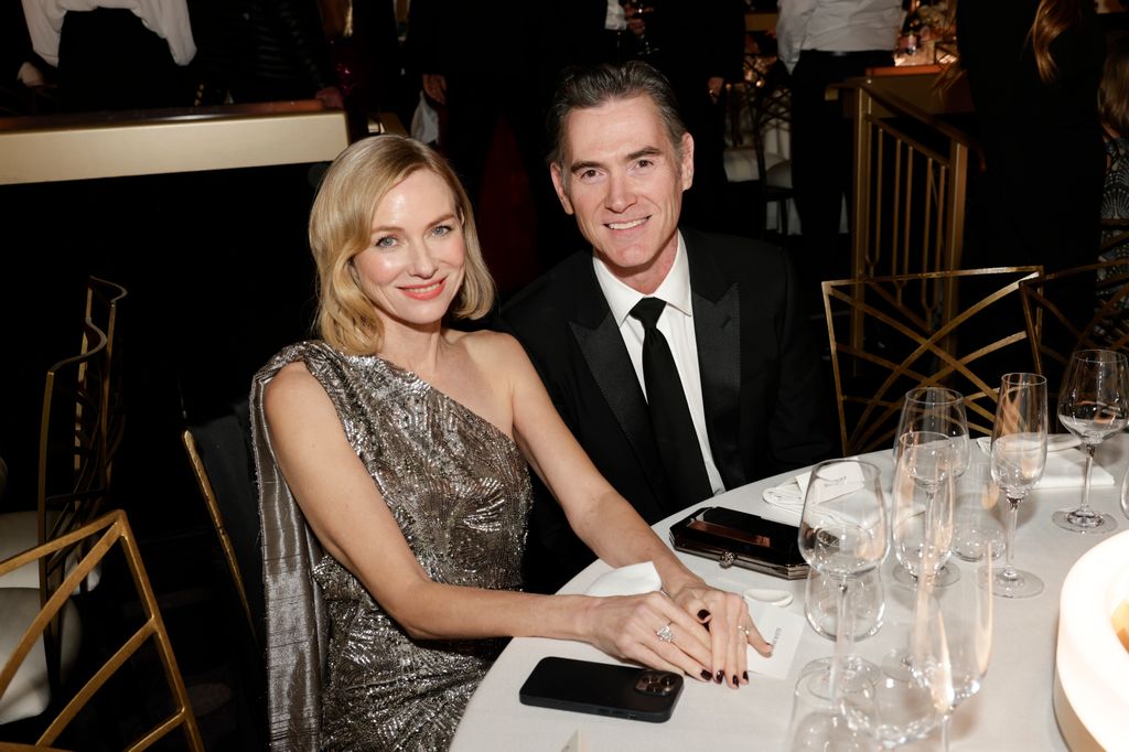 Naomi Watts and Billy Crudup sitting at a table at the 81st Annual Golden Globe Awards