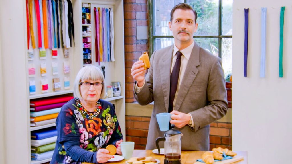 Esme Young, Patrick Grant holding biscuits on grat british sewing bee