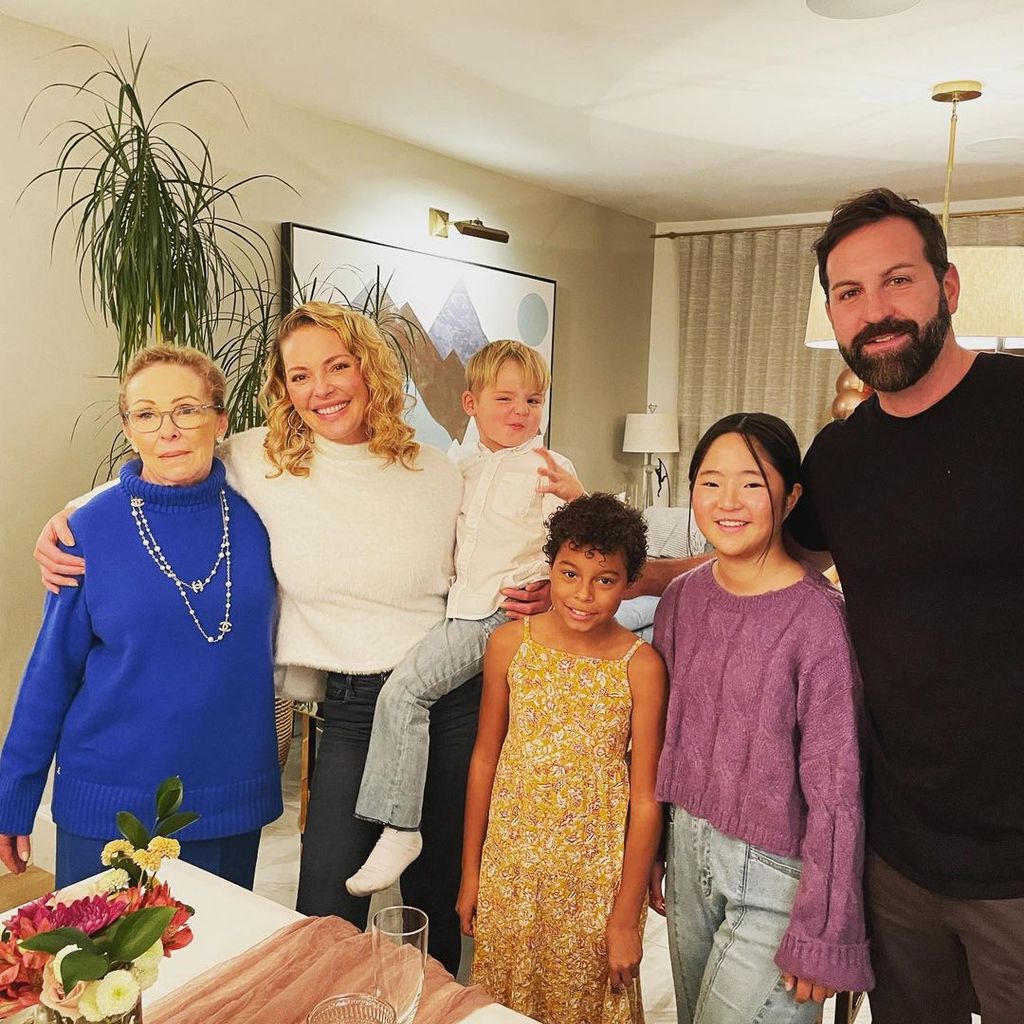 Katherine and her husband Josh Kelley with their three children and her mom 