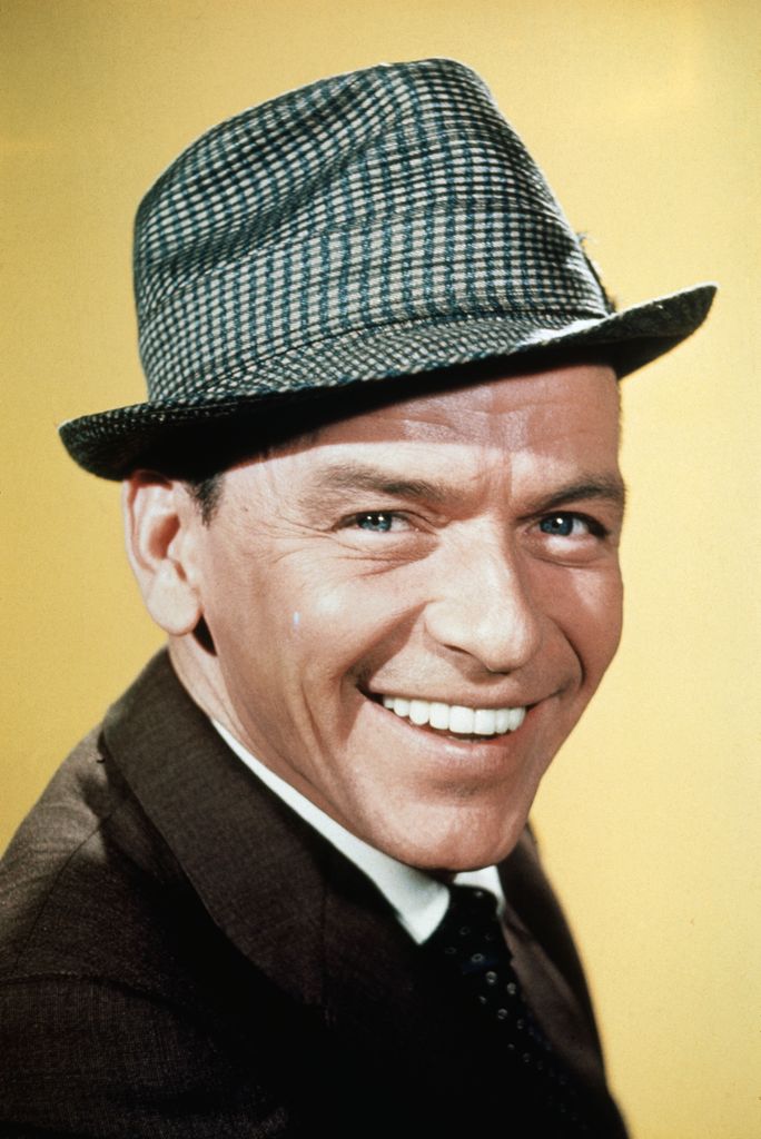 The popular American singer Frank Sinatra is shown here in this closeup photo smiling