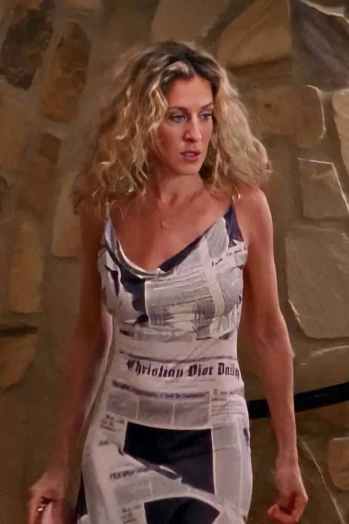 Carrie Bradshaw wearing the iconic Dior newspaper dress