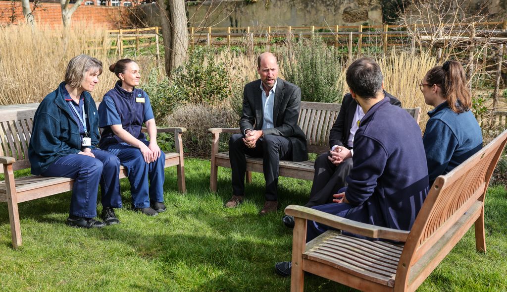 Prince William talks to NHS staff members in the Health and Wellbeing Garden
